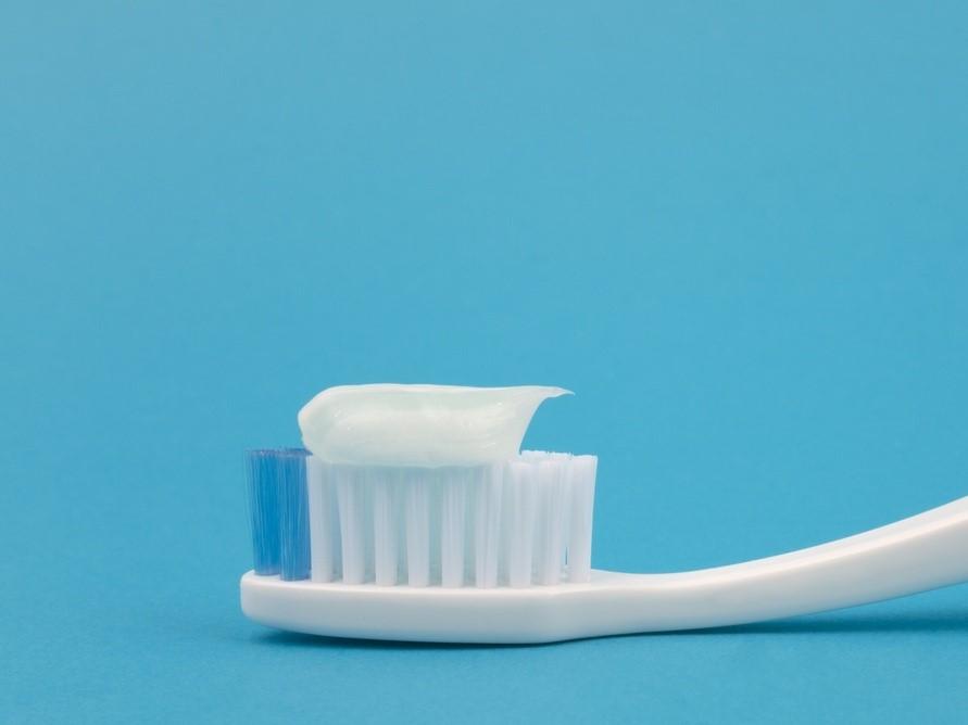 toothpaste on brush